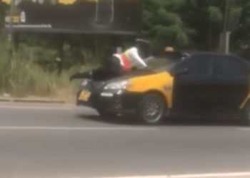  Taxi driver who sped off with police officer on his bonnet  sentenced to two years in prison