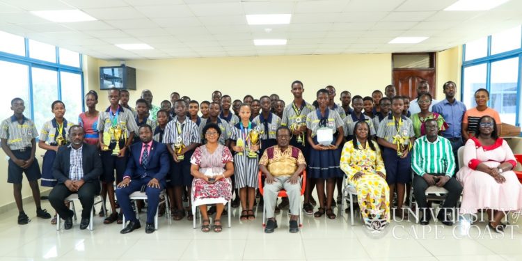 UCC Spelling Bee winners present awards to management