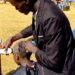 Kenyan school shaves off female students' long hair