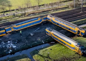 Dutch rail crash: One dead after passenger train hits crane and derails