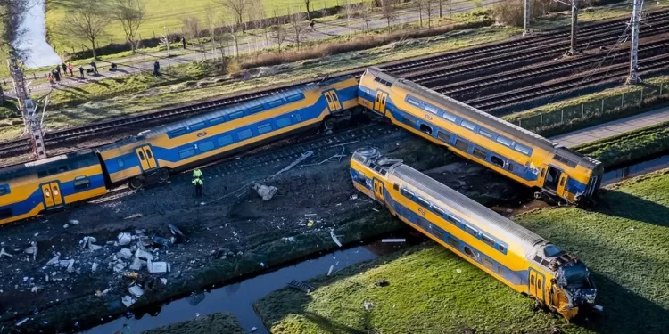 Dutch rail crash: One dead after passenger train hits crane and derails