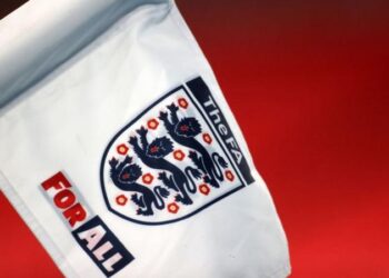 The Football Association says it is "working to find a resolution" after a transgender player stopped playing football when rival clubs refused to play against her.