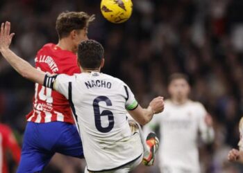 Atletico recues late draw with leader Real Madrid