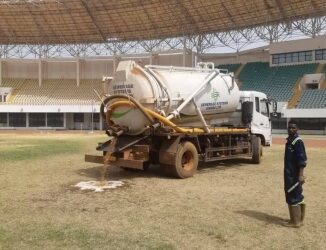 PHOTO: Maintaining the grass at the Aliu Mahama Stadium in Tamale