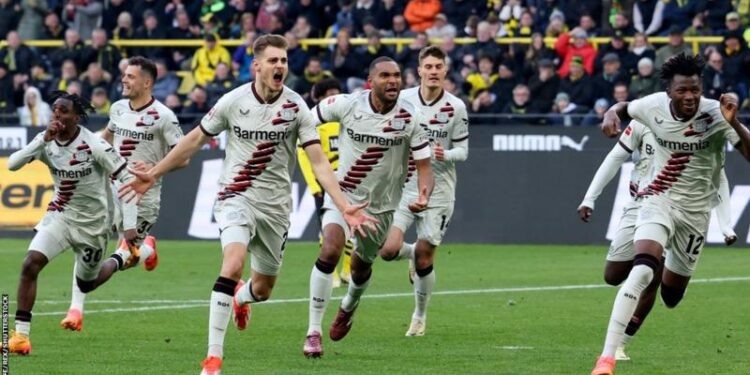 Stanisic’s late goal against Dortmund keeps Leverkusen’s unbeaten hopes alive