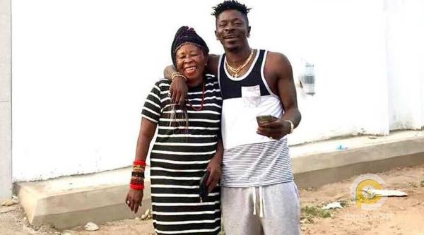 Shatta Wale smiling with his mother