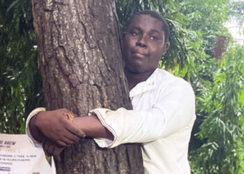 Ghanaian journalist hugs tree for 24 hours to break record and promote reforestation