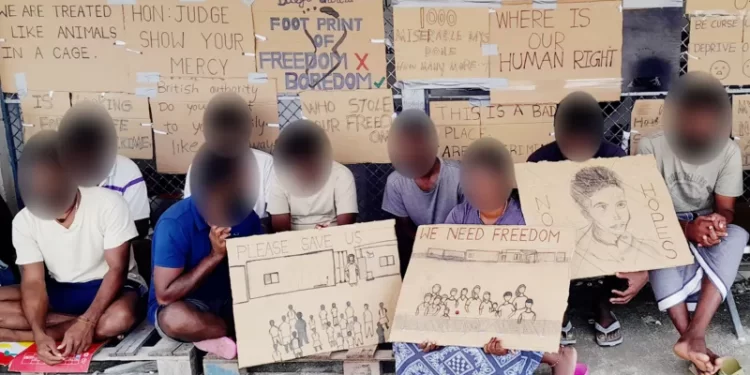 UK seeks to move migrants held on secretive island