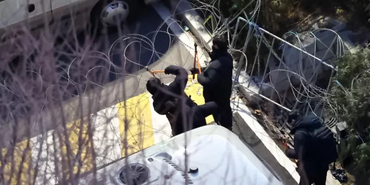 S Korea impeached president arrested after investigators scale walls